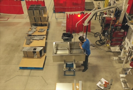 An Earnest Products worker, fabricating machine parts